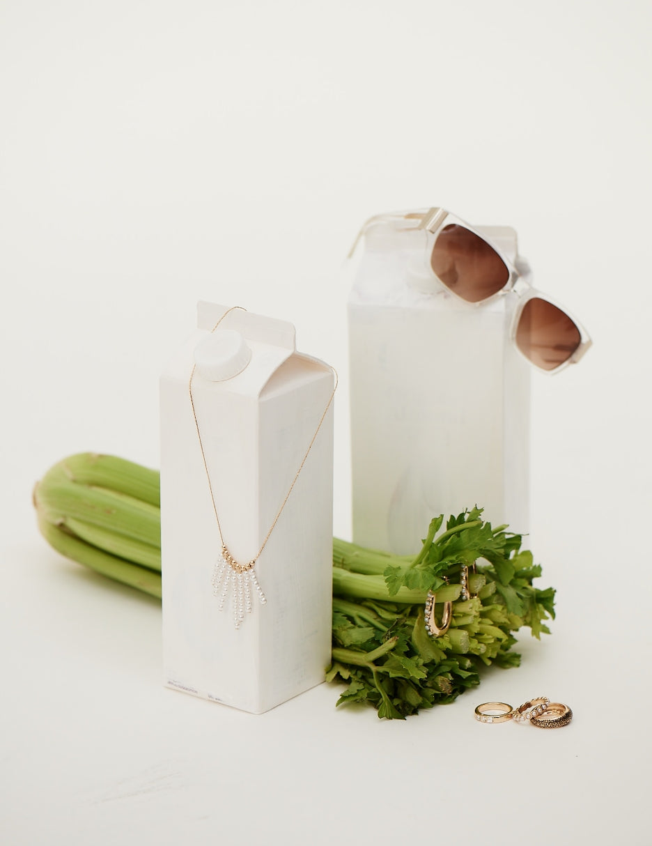 celery, milk cartons, and isaac mizrahi jewelry and sunglasses 