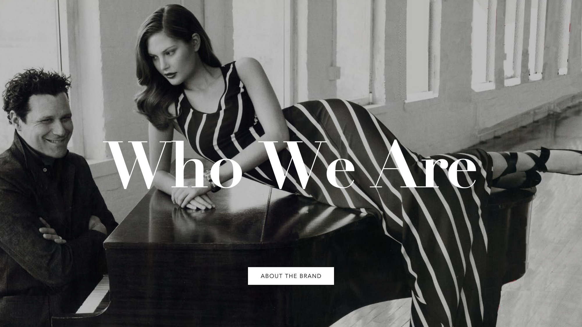 who we are copy over an image of isaac mizrahi sitting a piano with a model laying on top of the piano 