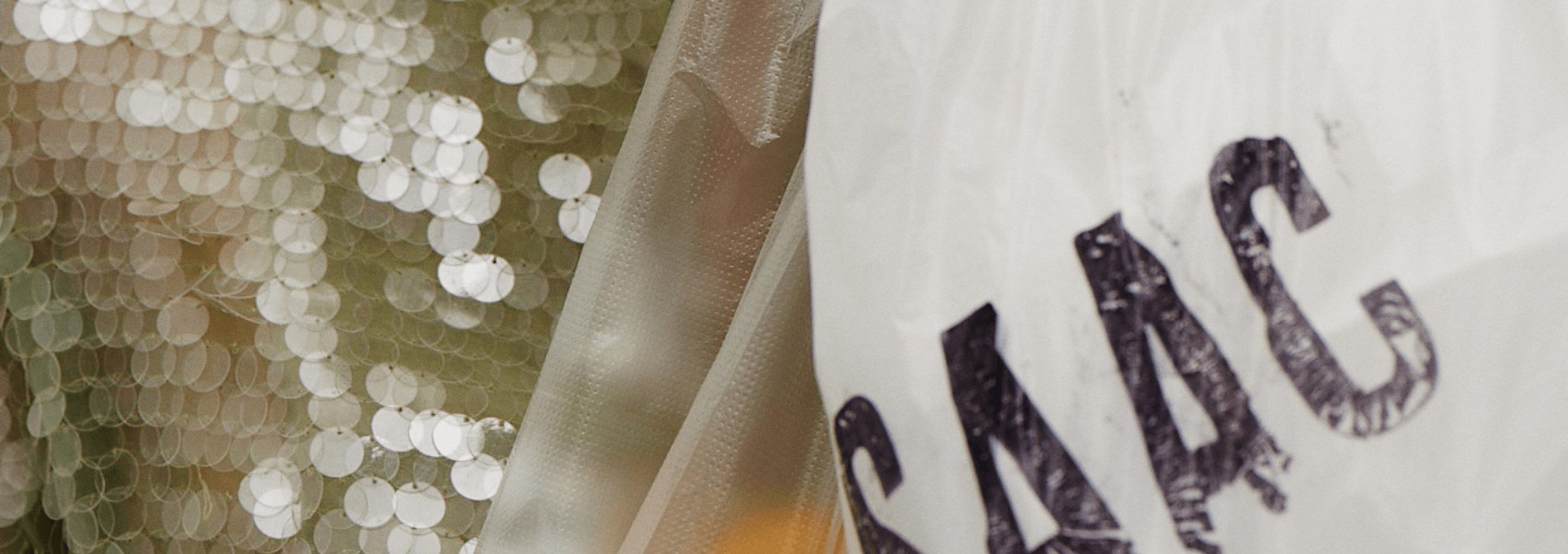 close up image of isaac mizrahi top and platic bag
