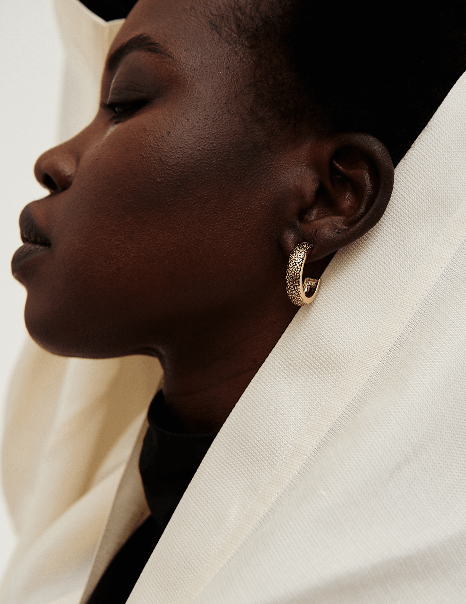Close up image of model wearing Isaac Mizrahi earrings 